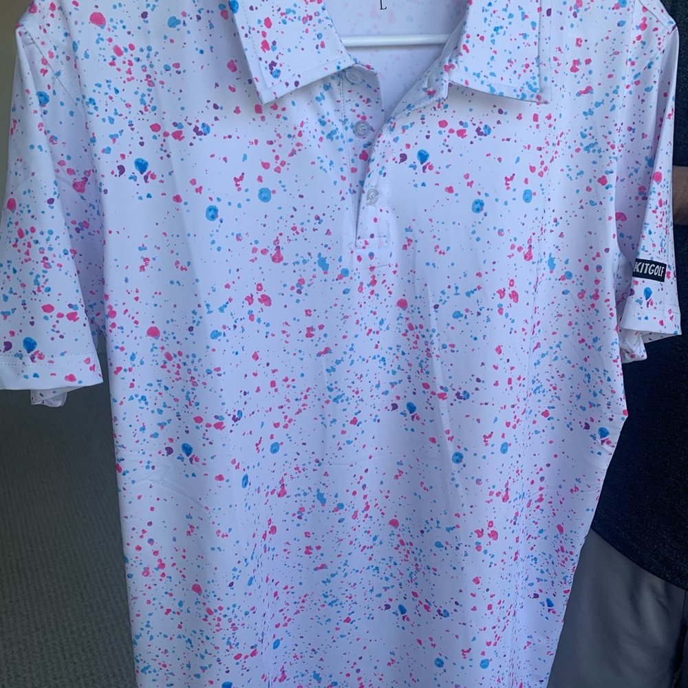 White and Pink Polo Shirt with Artistic Splatter Design from SHANKITGOLF.